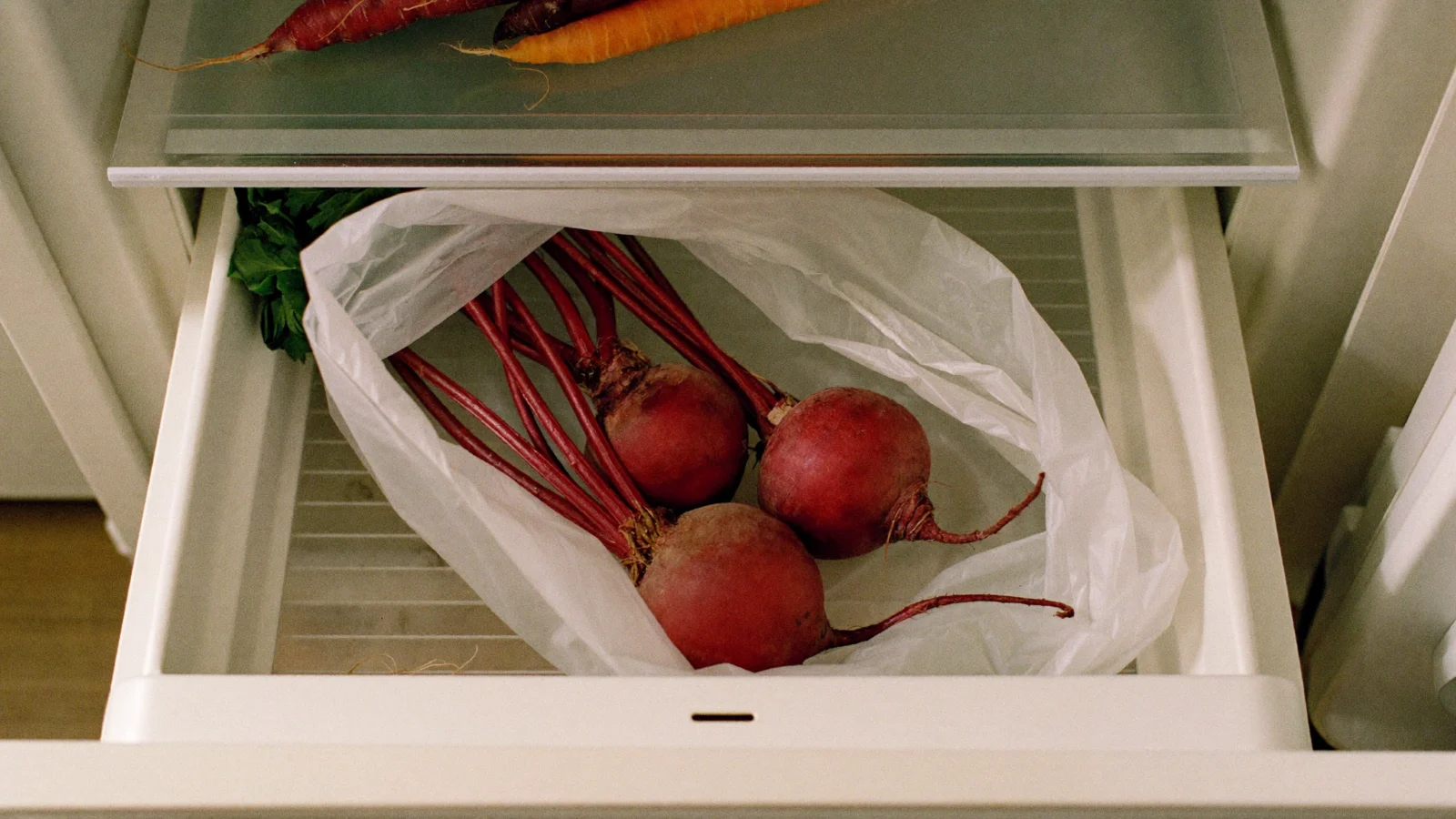 Store beets with the leaves cut off in a plastic bag in the fridge crisper drawer
