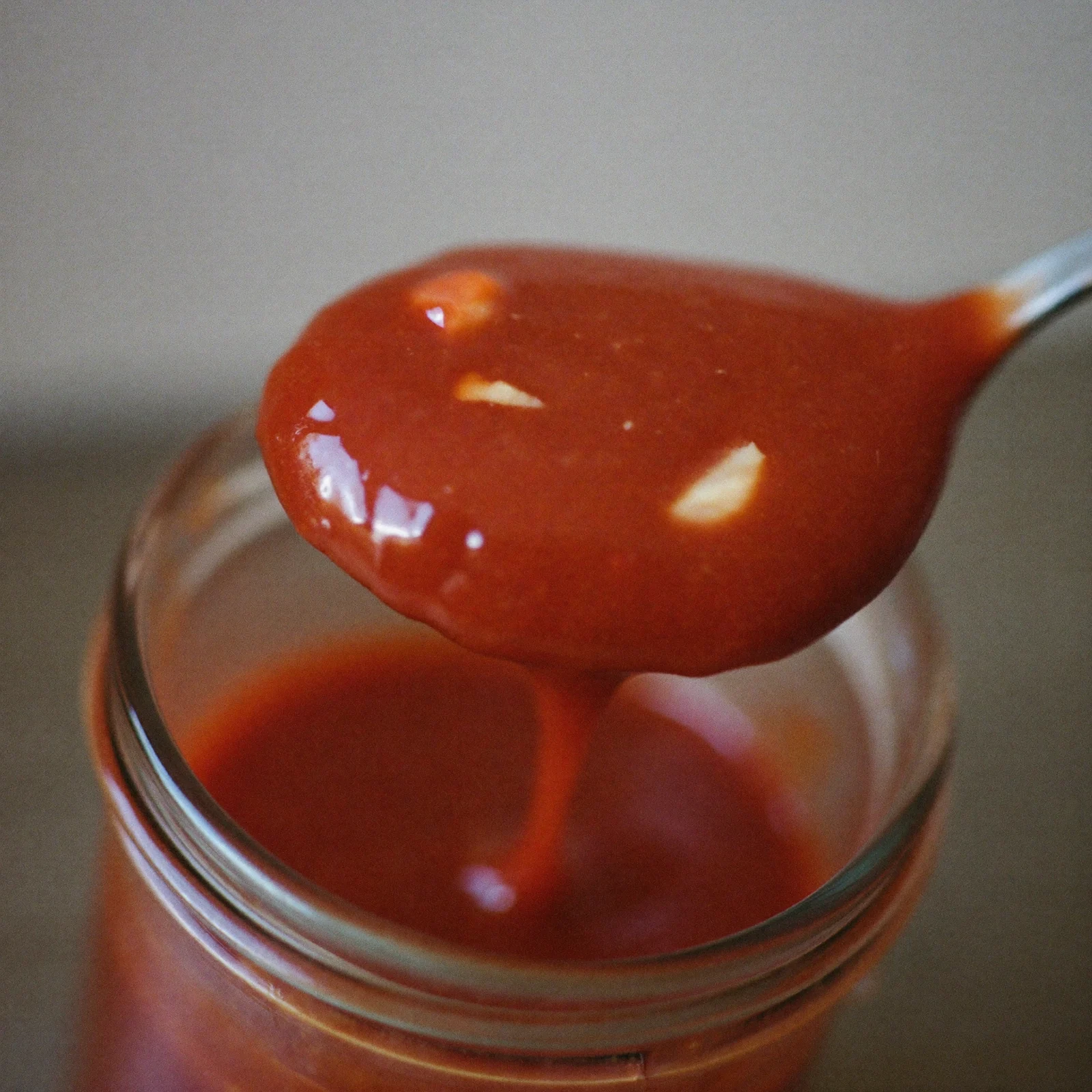 Older cocktail sauce that has turned a deeper brick red