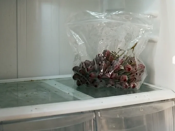 How to store Grapes - A vented bag of grapes on the coldest shelf, the place to store grapes so they last.
