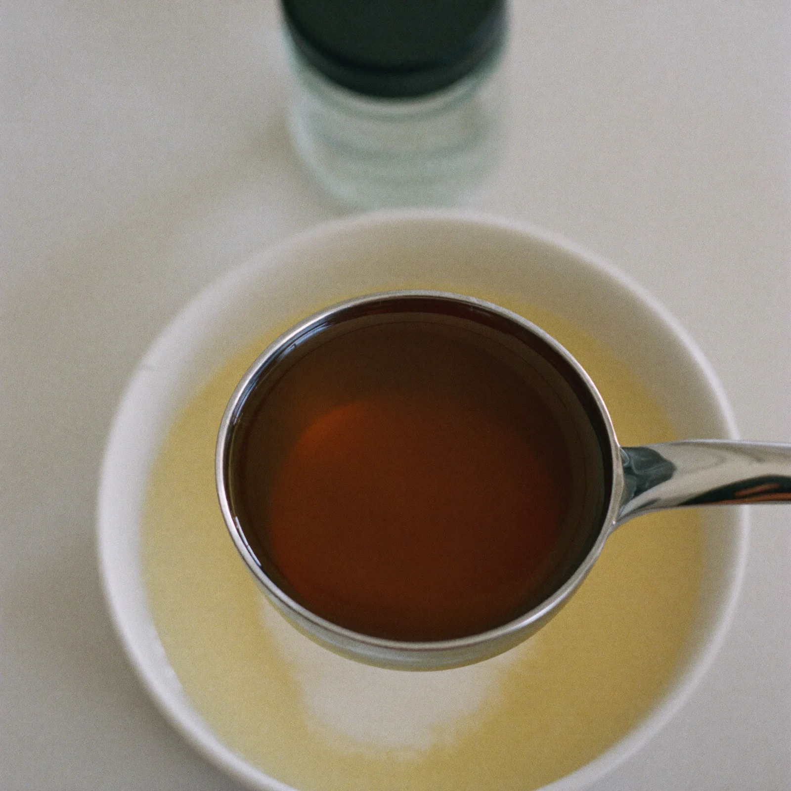 Fresh imitation vanilla, clear and brown, in a measuring spoon
