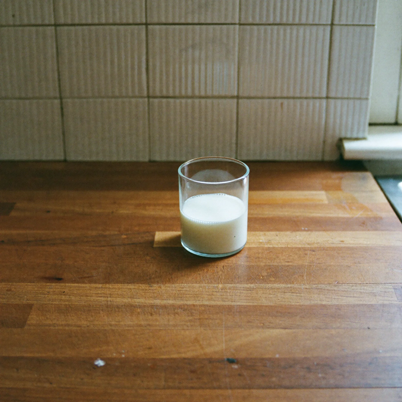 Fresh milk poured into a glass, smooth and even white