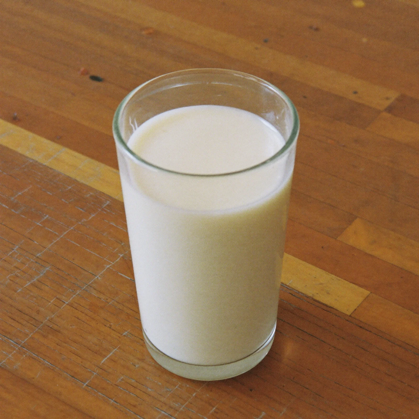 A glass of milk that looks ordinary but smells sour