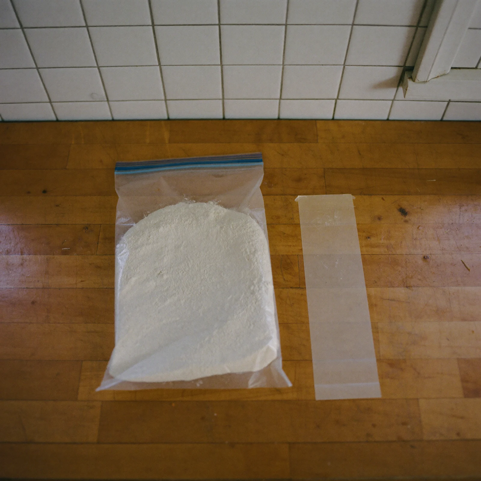 Self-rising flour pressed flat in a plain freezer bag with the air squeezed out